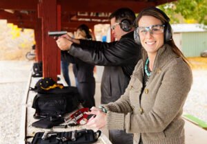 A group of people practicing at the gun range. Photographed on location at a shooting range.